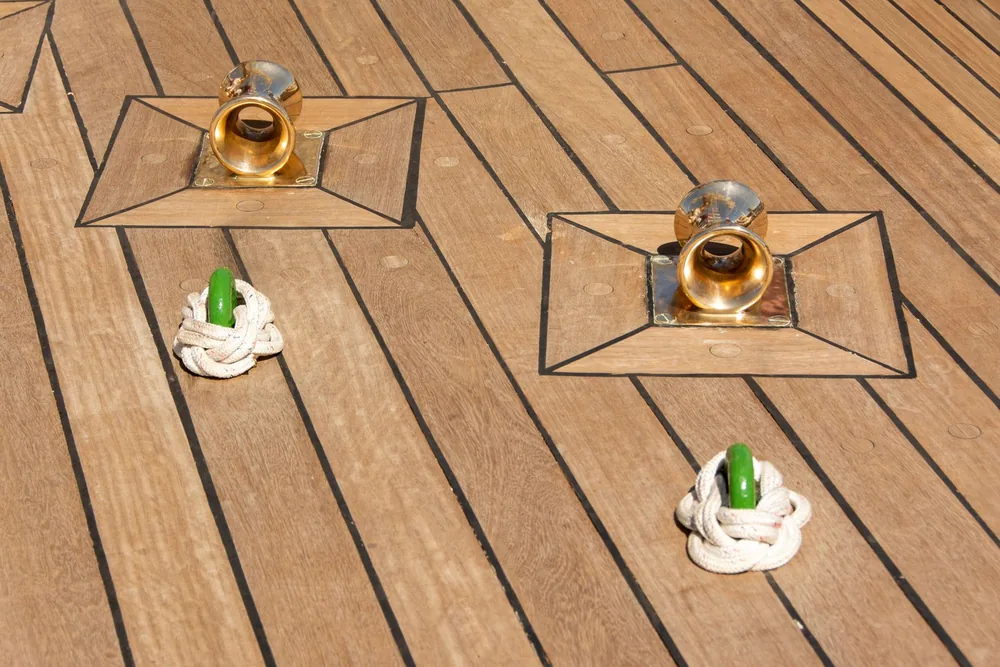 Freshly laid teak deck with new deck fittings